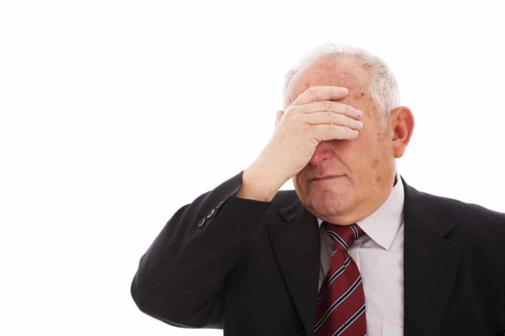 embarrassed businessman lawyer facepalm face palm old man